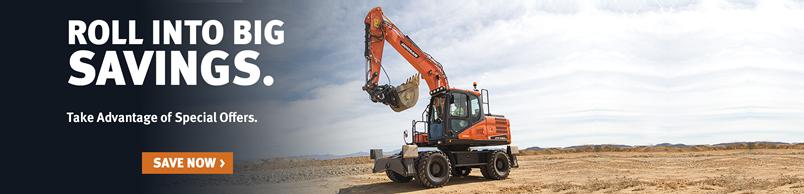 Doosan DX140W-5 wheel excavator moves across a jobsite.