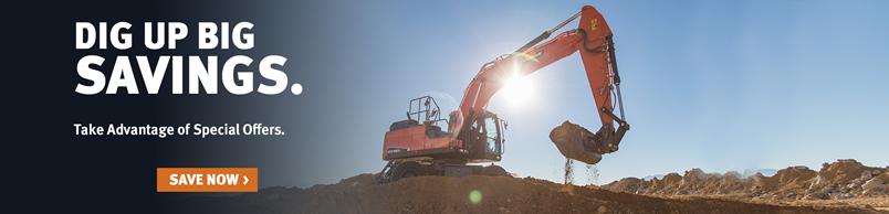 Doosan DX190W-5 wheel excavator digs with a bucket attachment.